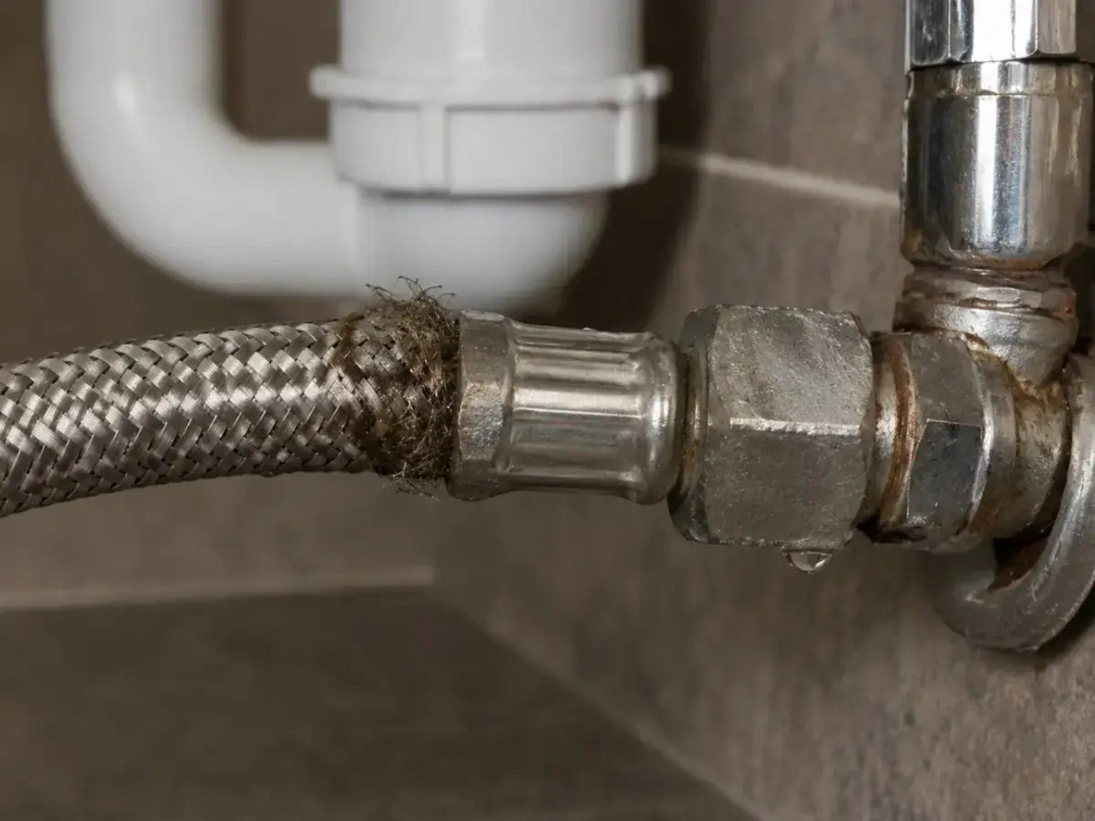 Frayed braided flexible hose leaking at the connector